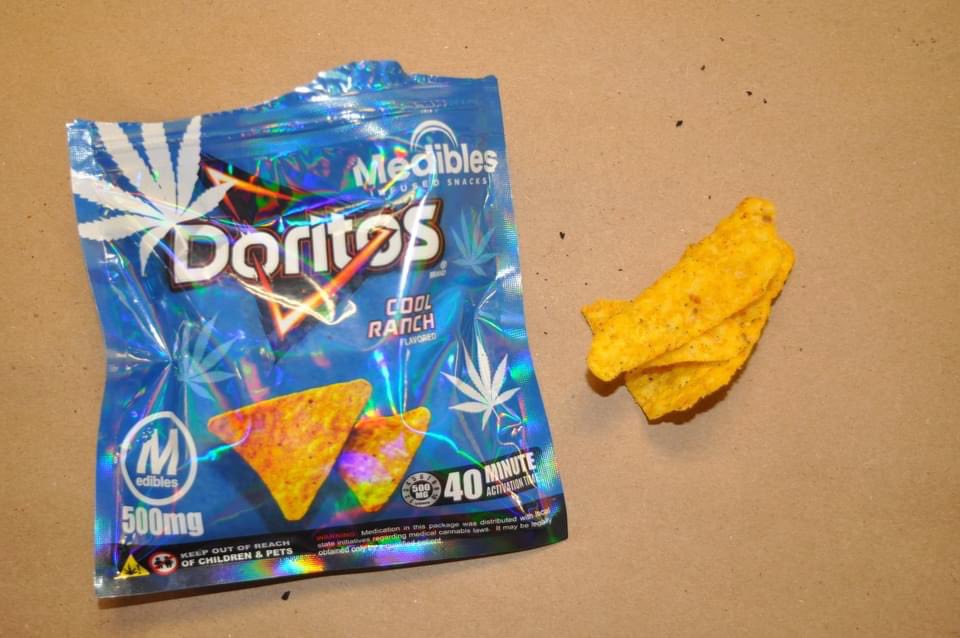 ColumbusPolice's tweet photo. RECENT SEIZURE FROM DRUG RAID: 

Besides guns &amp; drugs, these THC laced edibles were recently seized from a drug raid on the city’s northeast side.

The THC edibles look like the real, legal, product and even include some of the same branding like Cheetos, Doritos, Fritos &amp; Oreo. https://t.co/q8fOFigEit