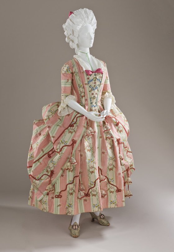 kateStrasdin's tweet photo. So fresh are the colours of this mid #1770s robe à la française that it looks as if it has just had its final silk chenille #trimmings stitched into place for the customer to admire. It is candy stripe bright, a chocolate box gown delectable in its details @LACMA #18thcentury https://t.co/pncdRpRleB
