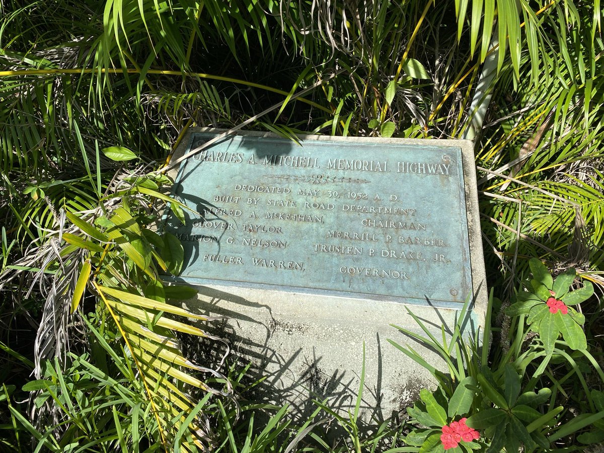 Where is this historical marker located and who was Charles A. Mitchell and where is this highway?