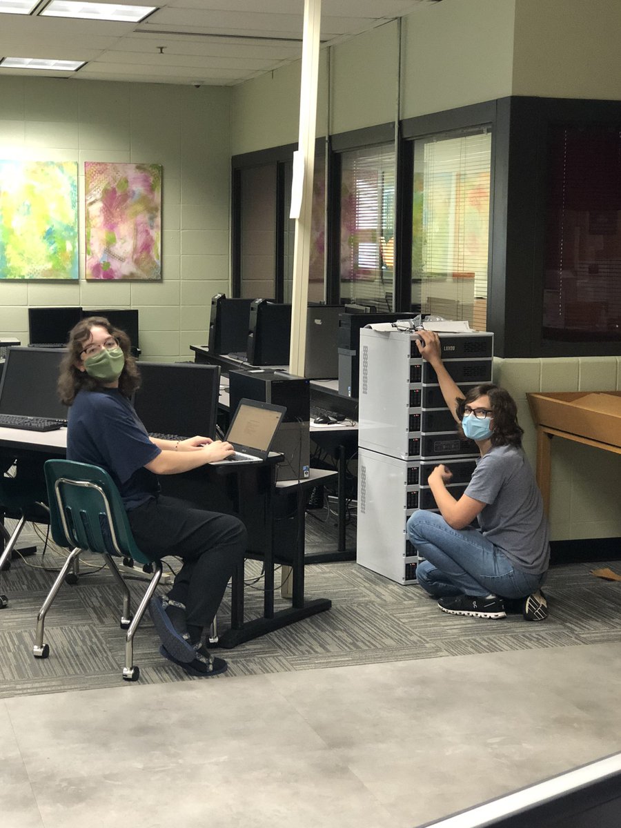 Two of the best library assistants ever setting up our new charging lockers. <a href="/GwoodHS/">Greenwood High School🐊</a> is lucky to have students like Nora and Logan!