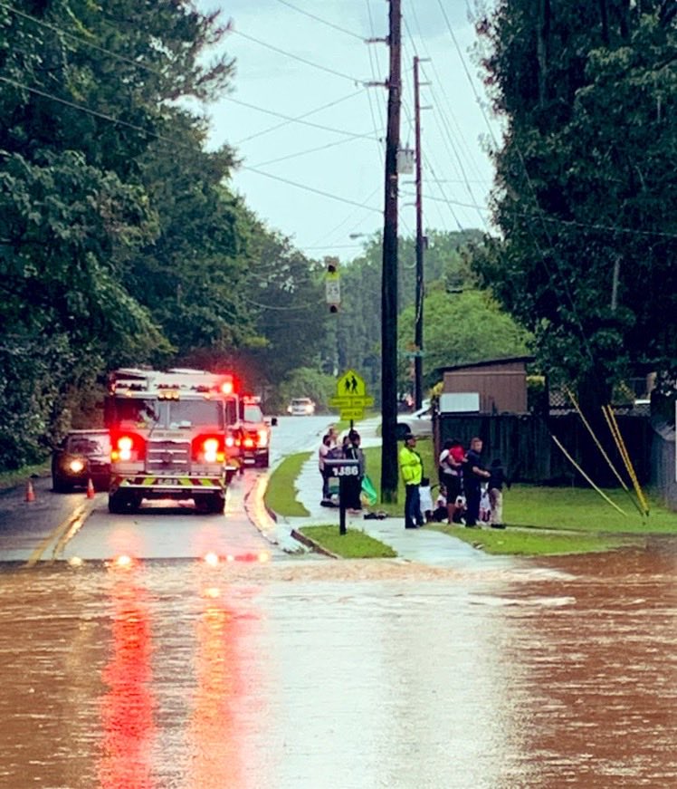 Cobb Firefighters evacuate more than two dozen children, 4 adults from day care surrounded by flood water in Austell.