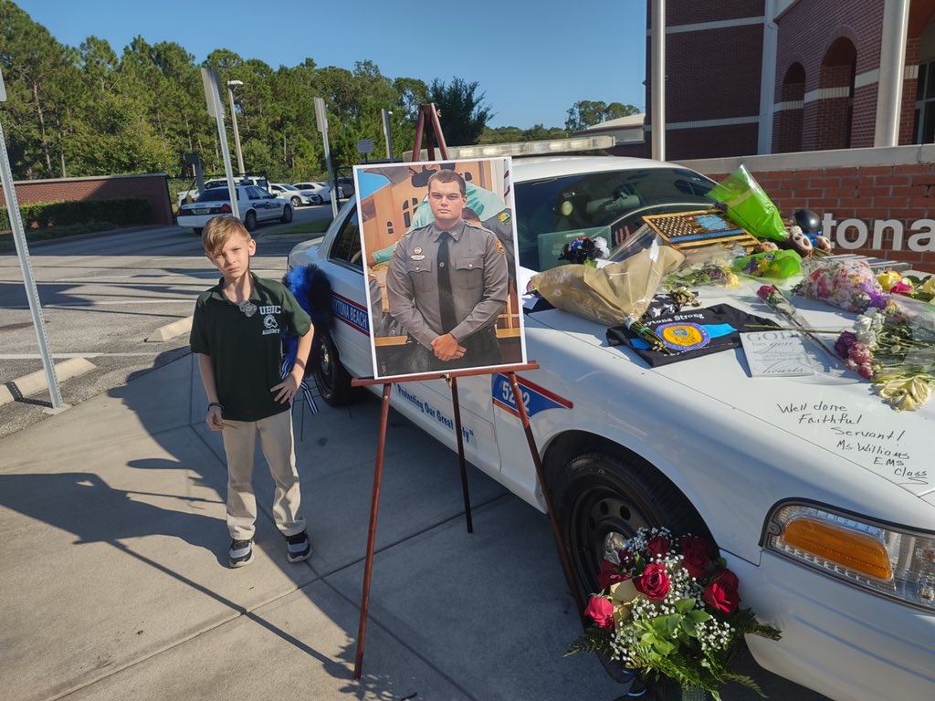realclairemetz's tweet photo. This is so sweet I had to share. AJ Hubbard turned 8 today &amp; his mom brought him to the @DaytonaBchPD Officer Jason Raynor memorial because AJ wanted to donate his birthday money to Officer Raynor’s mom. “I want to help her smile. I know she feels really sad because I do too.” https://t.co/7aKOSTX6nW