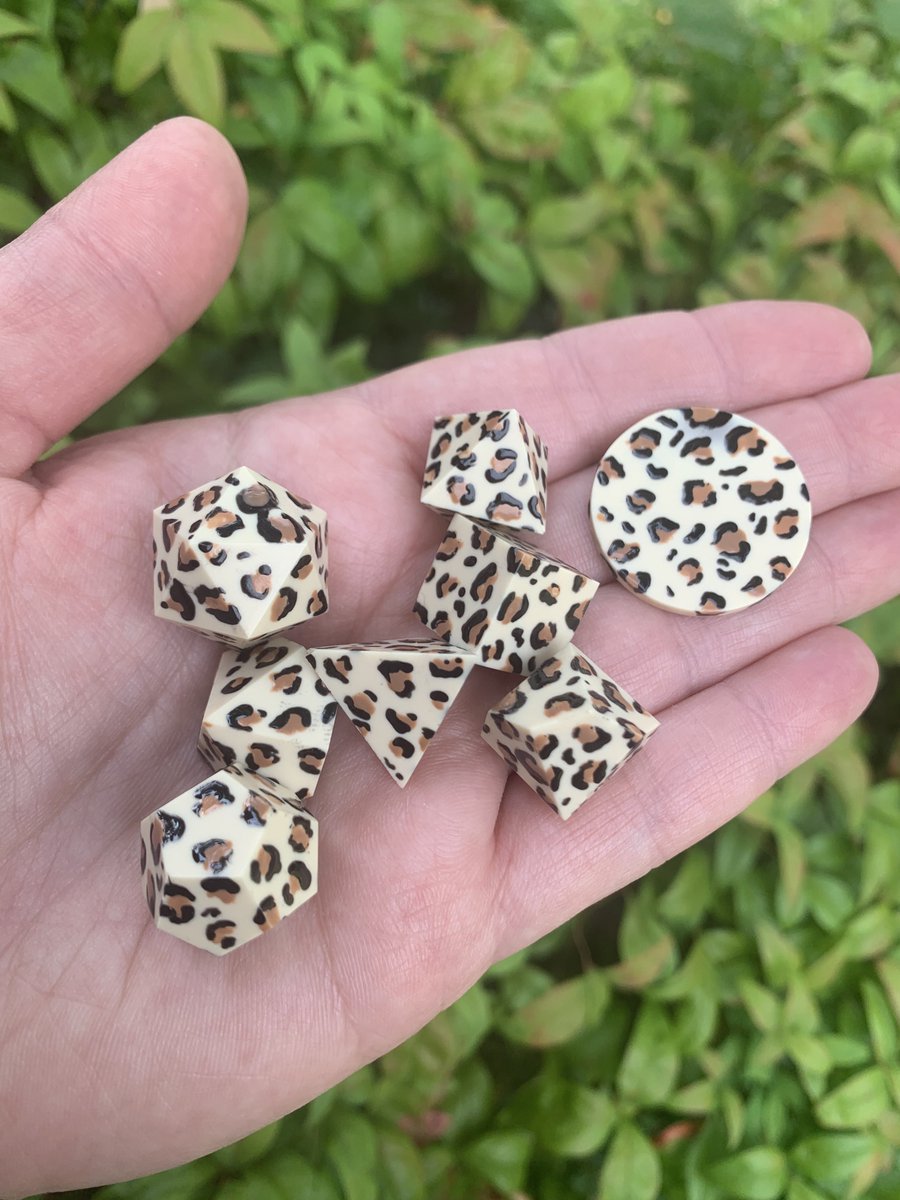 SpaceKittyDice's tweet photo. These are hand painted blanks inserted into clear resin. Protecting the paint job so they stay purrrrrfectly spotted for good. https://t.co/7UvHXt4mGn