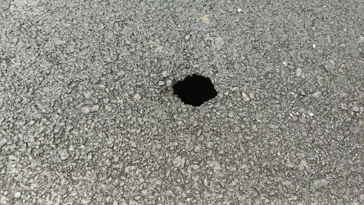 mhh2424's tweet photo. @VaDOTNOVA There is a sinkhole forming in pavement on Westover Street and Shady Lane. Depth is probably 2 feet and width is 3 feet under the hole in the picture. https://t.co/6V11IU0dEE