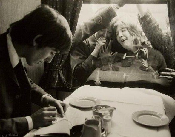 George Harrison signing autographs for fans. London, 1964.