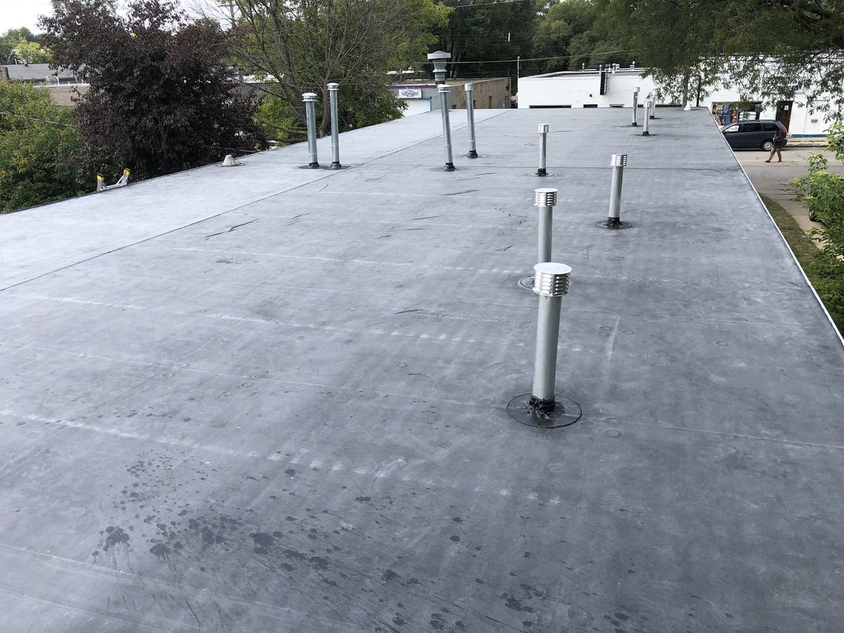 Steel on almost flat roof = leaks, our crew did a great job removing and replacing with EPDM rubber here in Rochester.  Call us at Heyn Brothers if you’re ready to replace your roof, estimates are always free!