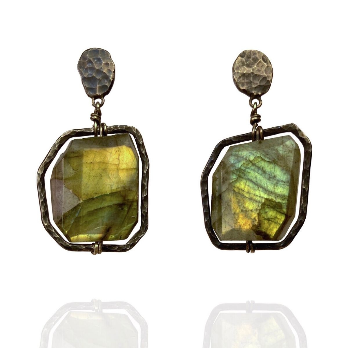 Oxidised sterling silver is a perfect frame to set off these glowing labradorite gemstones. The hand-textured metal surfaces and unique irregular forms make these stud earrings truly eye-catching. Made as a one-off pair.

Designer - Camilla West
ow.ly/YbkZ50FUKZp