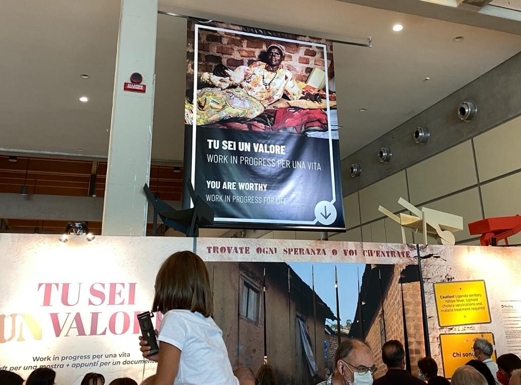 EduCannotWait's tweet photo. "My heart is deeply moved, as I see the compassion &amp; expertise in @FondazioneAVSI work" ~ #ECW Director @YasmineSherif1 visiting the "You Are Worthy" exhibit at @MeetingRimini showing #AVSI's work in #Uganda with vulnerable #women. https://t.co/8ZhwzpPAjm