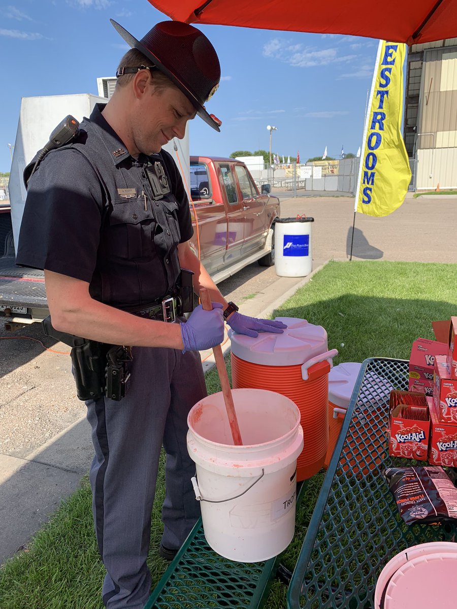 NEStatePatrol's tweet photo. Oh yeah! It’s @koolaid Days in Hastings! 

Trooper Scott was mixing and serving a bit this afternoon. 

#KoolAidDays #Nebraska #PatrolTheGoodLife #PathForward https://t.co/gPlpC8BQ7U