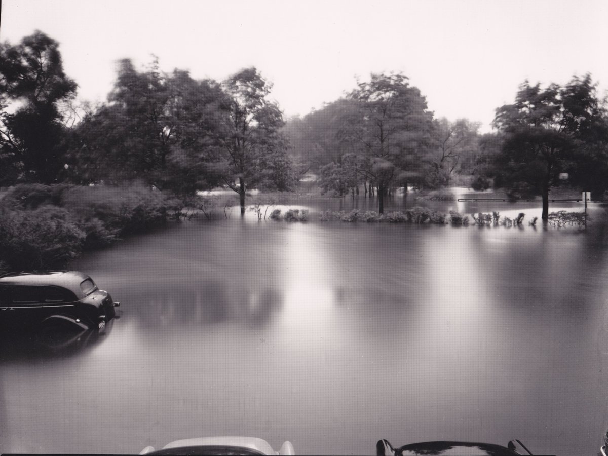 HistoricNewton's tweet photo. Due to #HurricaneHenri, the #JacksonHomestead and #DurantKenrick House are closed on Sun 8/22. This photo shows a #flood outside #NewtonMa City Hall in #1955 - we hope we don't see something similar in this storm! https://t.co/tKntjownMW