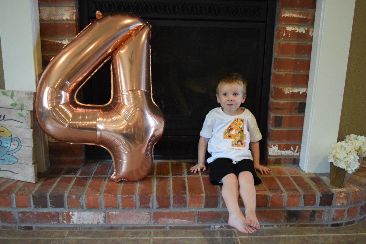 E is FOUR! He looked in the mirror this morning to see if he looks older. The verdict: he's not bigger yet and doesn't have gray hair. He is, however, "old enough to eat hot food."