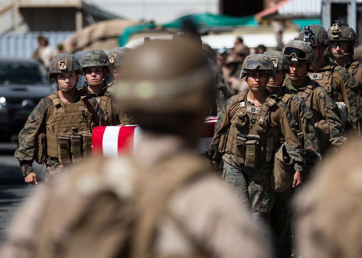 United States Marines honor their fallen during a Ramp Ceremony at Hamid Karzai International Airport, August 27.