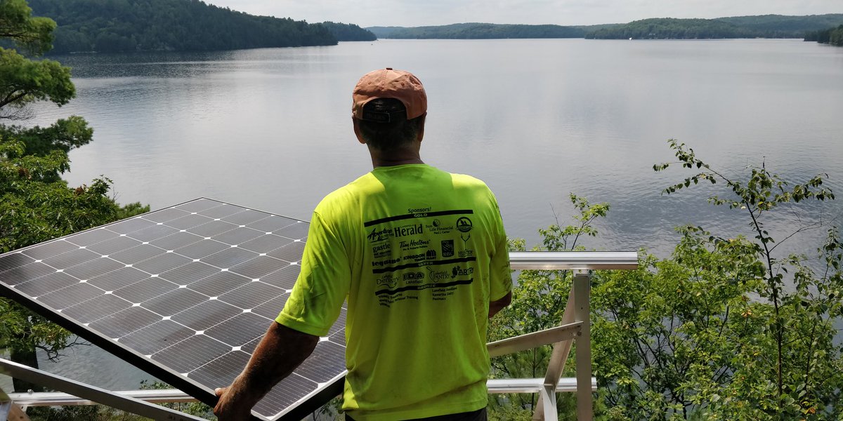 Apart from the view, the advantage of installing solar in a place like this when it is 30 degrees is that you can jump in the lake to cool down