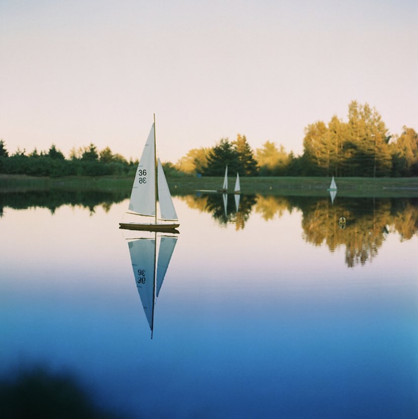 LostRollsAmeric's tweet photo. “This is a 36" pond yacht. The sails and rudder are radio controlled. The wind is what makes it move. It is part of a building/sailing class at the WoodenBoat School in Brooklin, Maine.” -JP, where: Brooklin, Maine, when: About 2003 https://t.co/9NCTgN1jfa