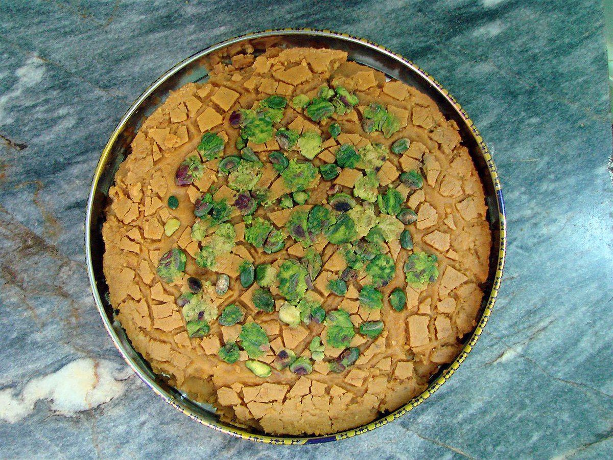 VisitIran3's tweet photo. #Sohan (#confectionery) 
is a traditional #Persian saffron brittle toffee made in #Iran (Especially in #Qom). Its ingredients consist of wheat sprout, flour, egg yolks, rose water, sugar, vegetable oil, saffron, cardamom, and slivers of almond and pistachio.
#ایران، #قم
#سوهان https://t.co/fS0TKSxoiu