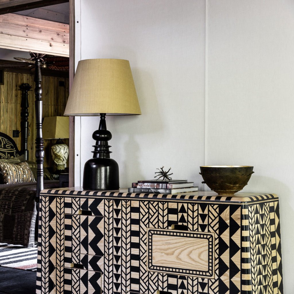 A hand-painted Kassena cabinet in this boutique bedroom at <a href="/XigeraLodge/">Xigera Safari Lodge</a>.
Available from #SouthernGuildGallery