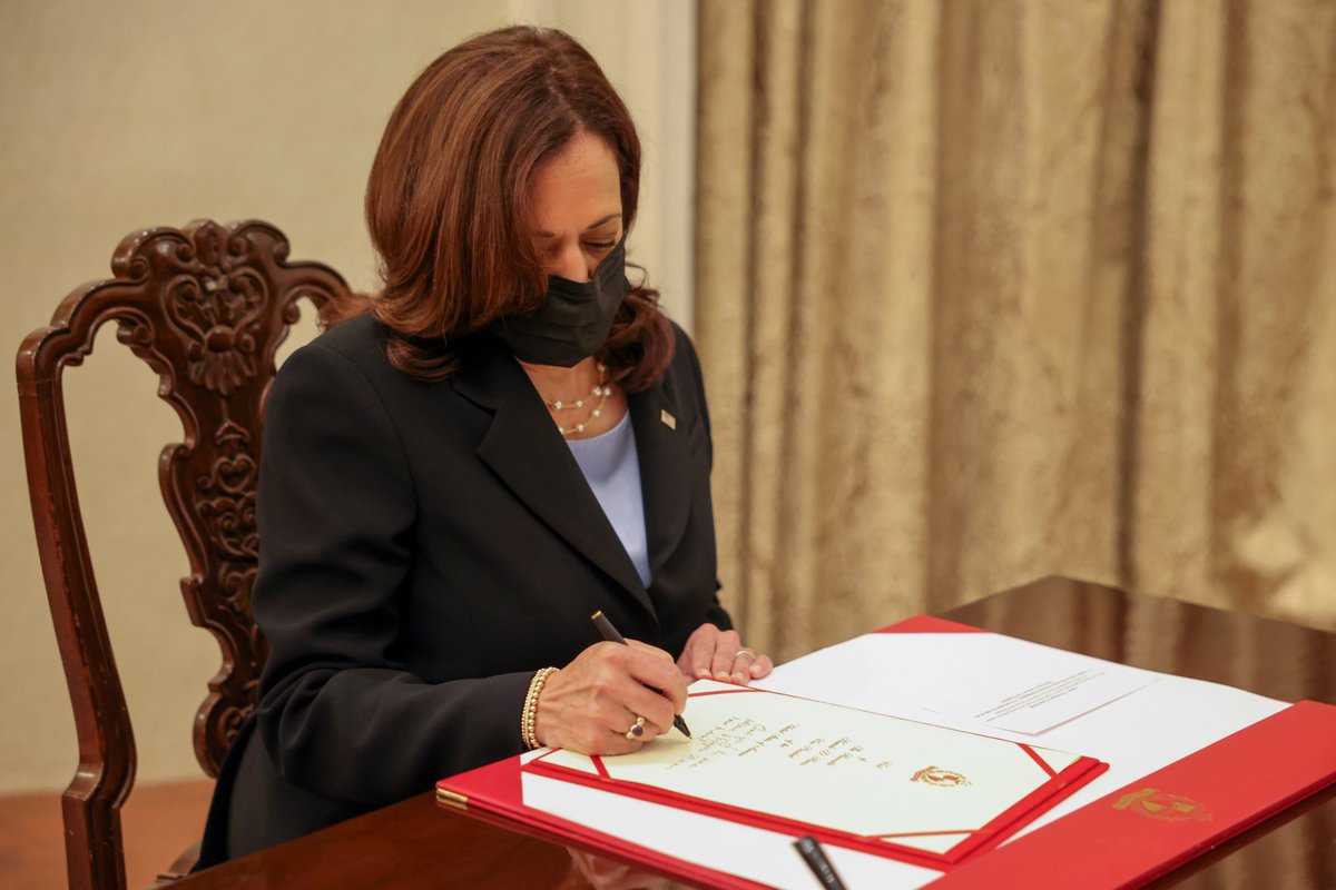 U.S. Vice President Kamala Harris signs a document at the Istana in Singapore Monday, Aug. 23, 2021. (Evelyn Hockstein/Pool Photo via AP)