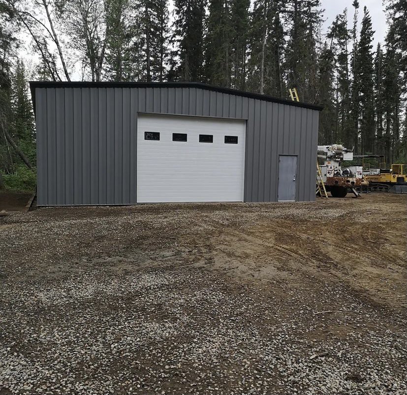 We sent out a small crew and they worked their tails off at Dore River Outfitters in July to get this job done quickly! Great work boys!

Fun fact…. This location is across the lake, so this building took its voyage across during the winter months on an ice road!