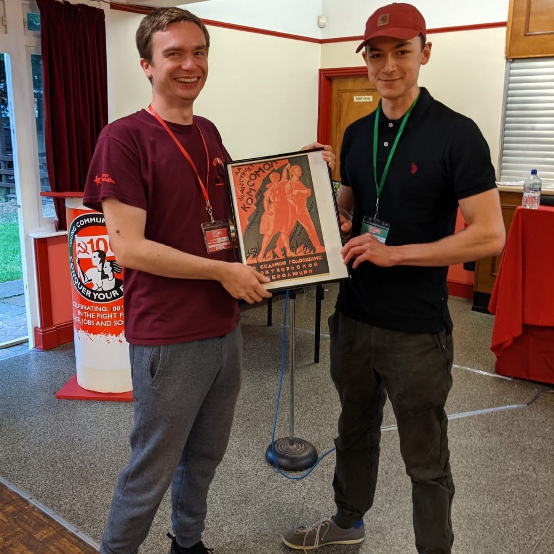 yclbritain's tweet photo. Young Communist League Chair, Robin Talbot, presented Congress Volunteer John Cassie with a framed replica poster from the Russian Komsomol ๐ฉ
1/2 #YCL100 https://t.co/cL3coTXyAc
