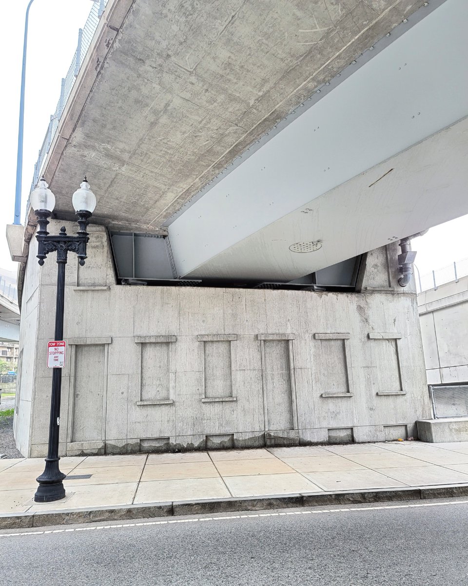 OnlyInBOS's tweet photo. The West End on-ramp has doors and windows imprinted in the concrete as a reminder of the former neighborhood there, completely leveled by the end of the 1950s as part of a large scale urban renewal project. https://t.co/CZMu3nfcnf