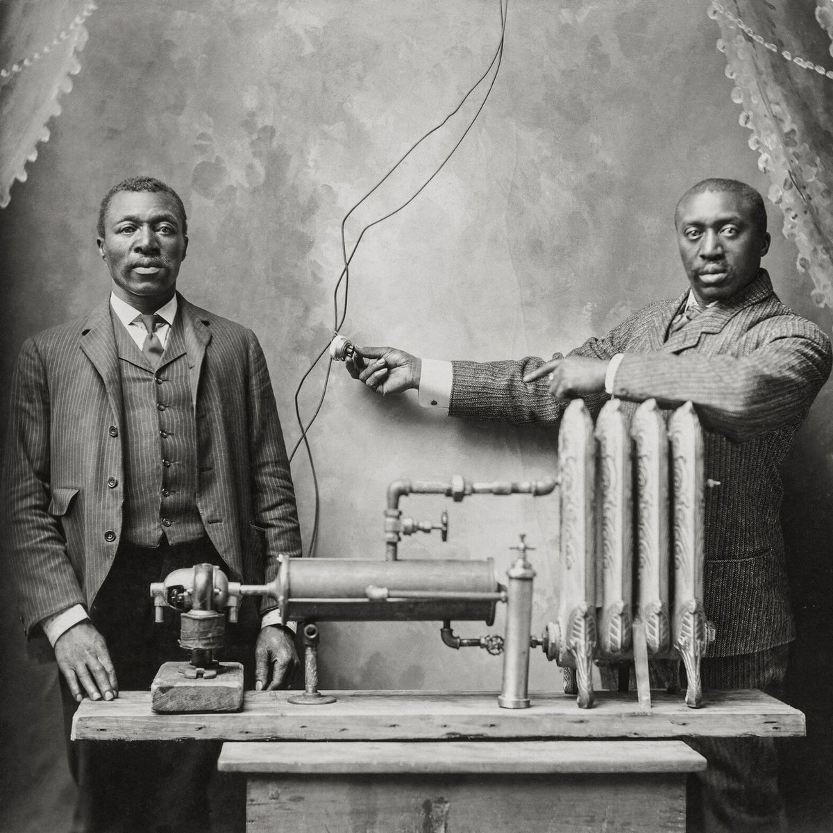 sarahelizalewis's tweet image. This image, found on a hunt for something else, just stopped me in my tracks. The focus. The pride. The clarity. Wow. Charles S.L. Baker, inventer of that heater we see in so many homes, with an unidentified man, possibly his brother Peter. St. Joseph, Missouri, Feb. 12, 1906.