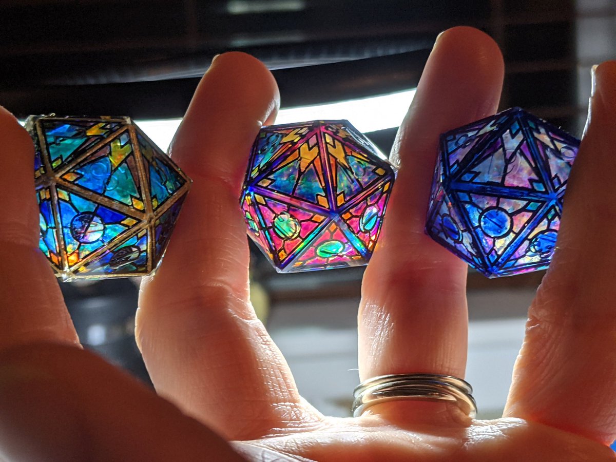 My experimental babies!  The one in the middle, she is perfection.  No flaws, just progress!  Get ready for a bright future!  See you soon!
#d20 #dice #polyhedraldice #dnd #dungeonsanddragons #pathfinder #rpg #handmadedice #stainedglass #moon #stars