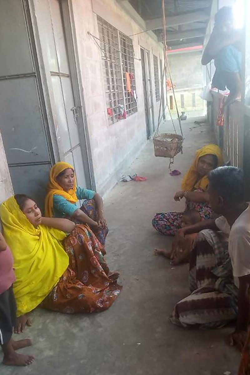 Senu Ara, 35, left, lost four members of her family after a Rohingya refugee boat capsized, at her residence on Bhasan Char, Bangladesh, August 15, 2021. © 2021 AP Photo