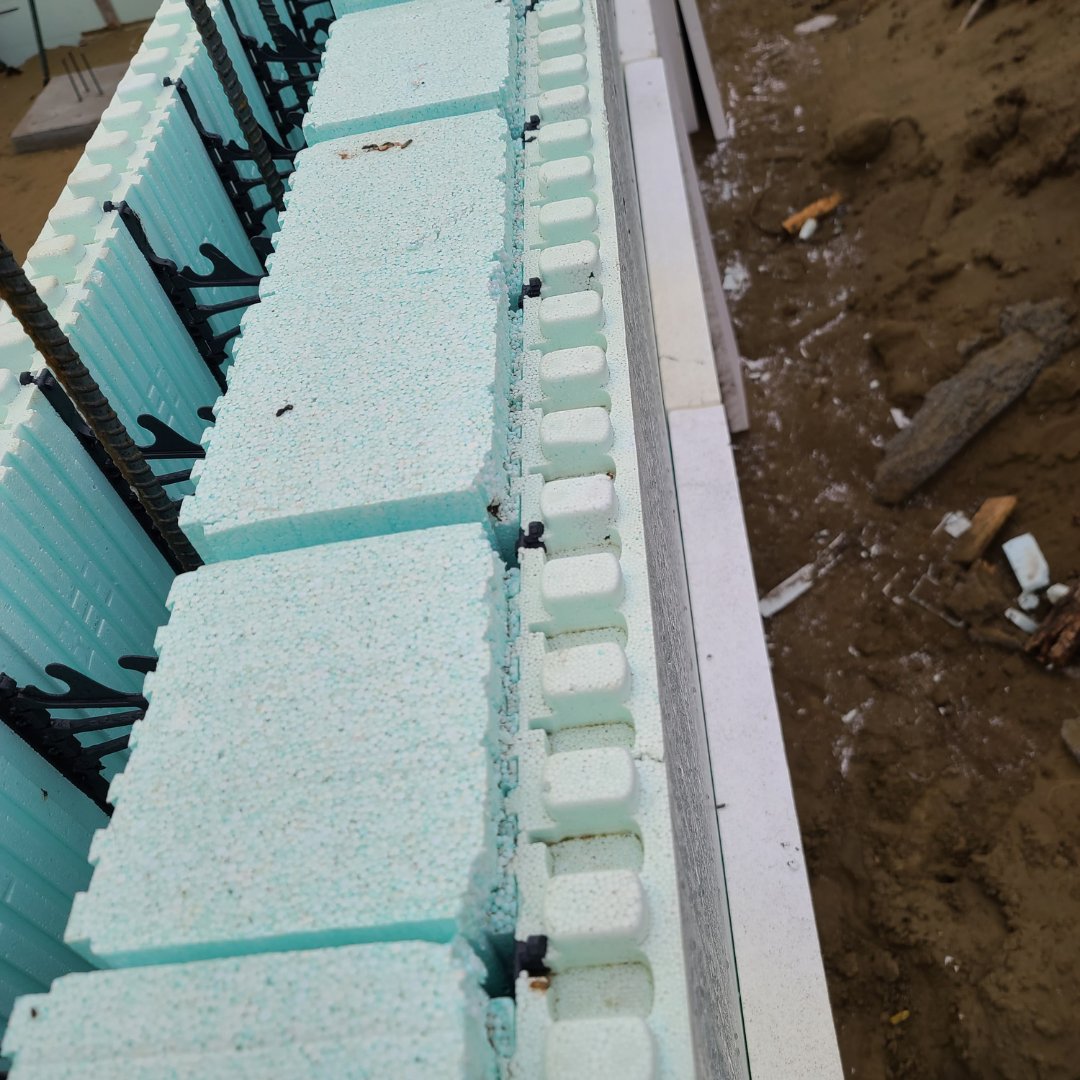 Here is a super-insulated home under construction.  
The builder is using a 12" <a href="/NUDURAICF/">NUDURA Insulated Concrete Forms</a> with 6" Plus-Series Inserts. An additional 3.5" Homega panel will be added to the outside of the wall after concrete has cured for an impressive whole wall value of approx R-62.