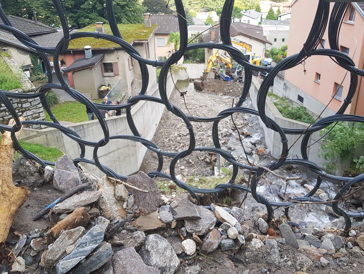 geobrugg's tweet photo. Ticino (Switzerland), early August: Our UX120-H6 barrier has worked perfectly.
The emptying and replacement of damaged elements will now take a few weeks.
#DebrisFlowProtection #RingNets https://t.co/Rpwpc7EkYA