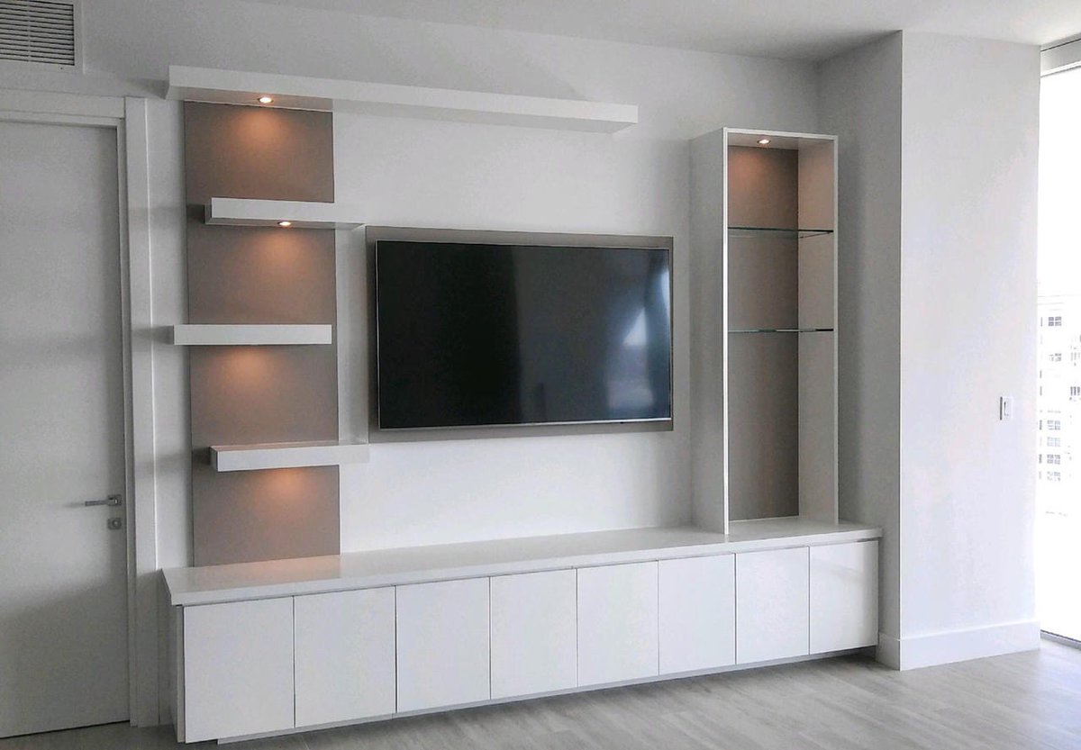 A modern marvel! The asymmetrical floating shelves give this entertainment center a cool decorative touch.