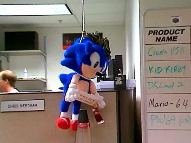 semifreqsonic's tweet photo. In the late 1990s, a Sonic the Hedgehog plush was hung by it's neck in a Nintendo of America office. This was when Sega and Nintendo were bitter industry rivals.

His sign read "Will run for food". https://t.co/WDBYD2McQJ