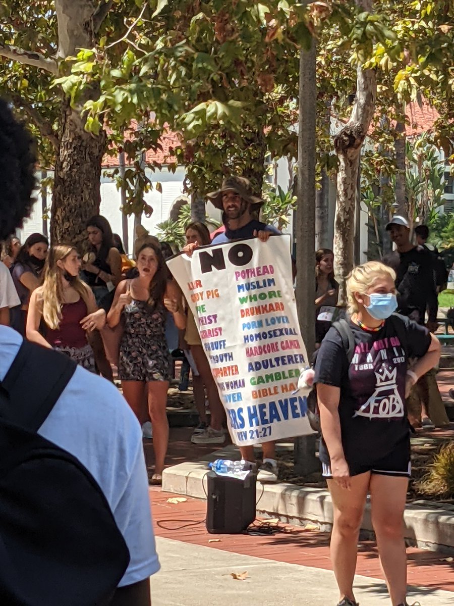 This guy at SDSU is an irl shitposter there's a huge crowd gathered around him