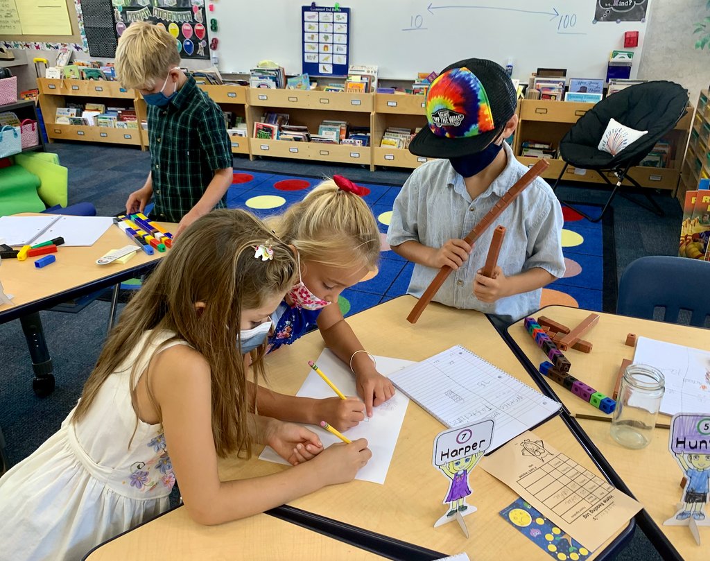 These 2nd grade students are working on Jo Boaler's Strategies for Learning Mathematics and are completing a 3 Act (see buff.ly/3ks43UT for a definition).  Collaborative problem solving is an important part of the MUS Math Philosophy. (picture credit: Mrs. Judy) <a href="/joboaler/">Jo Boaler</a>
