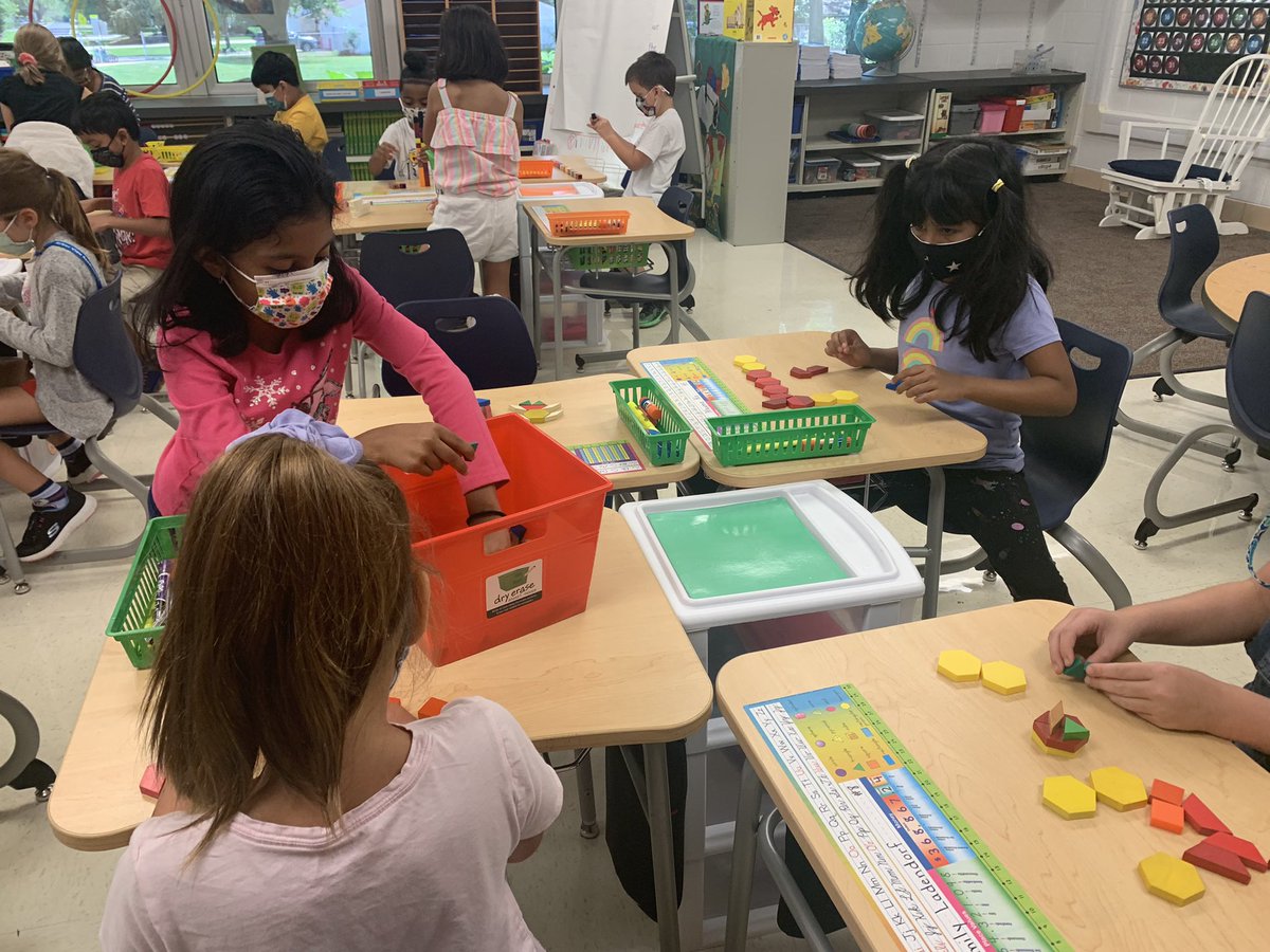 Exploring math tools during Bridges Work Places this afternoon.