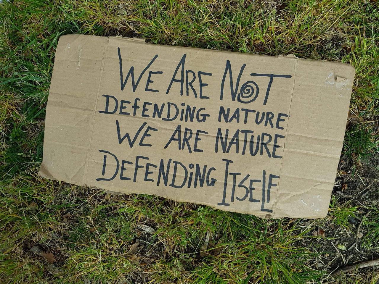 Sign that says: "we are not defending nature, we are nature defending itself"