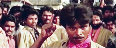 Malayalam comedian/actor , Indrans as Baasha Surendran in movie - three men army (1995). His new movie #Home is a big hit in OTT platform.