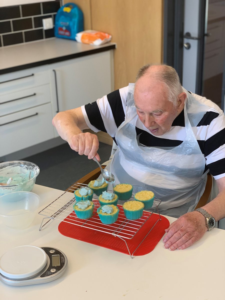 Walter icing some cupcakes