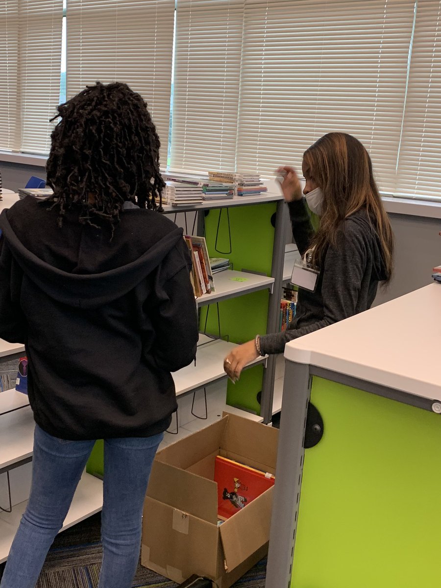 LibrarianDavis's tweet photo. These amazing TCHS students came to help with putting the library together today! What took them 40 minutes would have taken me HOURS! I’m so thankful for their hard work! @NIS_Wildcats @tcss_schools #bettertogether #WildcatCountry https://t.co/ZlLDzhuIfQ