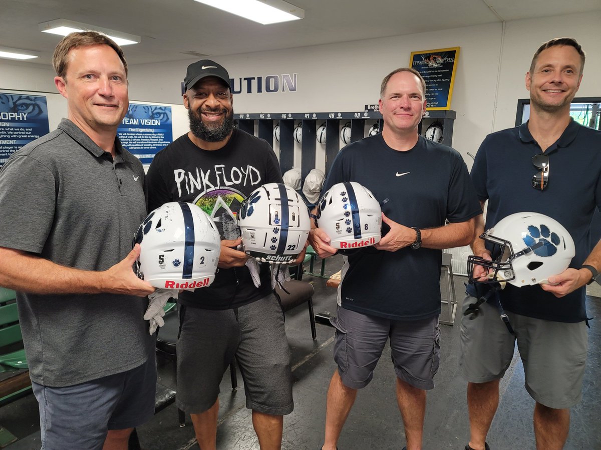 TwinsburgFB's tweet photo. The Tigers tradition of a players significant role model placing his decals on his helmet continues! What a great turnout of dad's, moms, aunts, uncles, big brothers, grandparents, and others! 
#BuildTheBrotherhood
#PCE https://t.co/s1jmSk4bhO