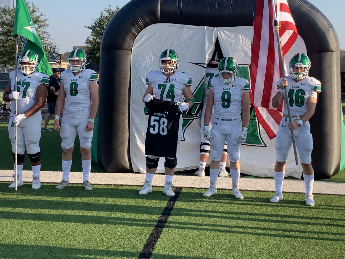 FridayNghtGlory's tweet photo. Special moment before the game as the @AzleHornets honor Offensive lineman Jack Schwantz @KennyMatthews @The_RightCall @AFGP_Sports @paytpeterson1 @KennyMatthews https://t.co/c4G6ndzhiP