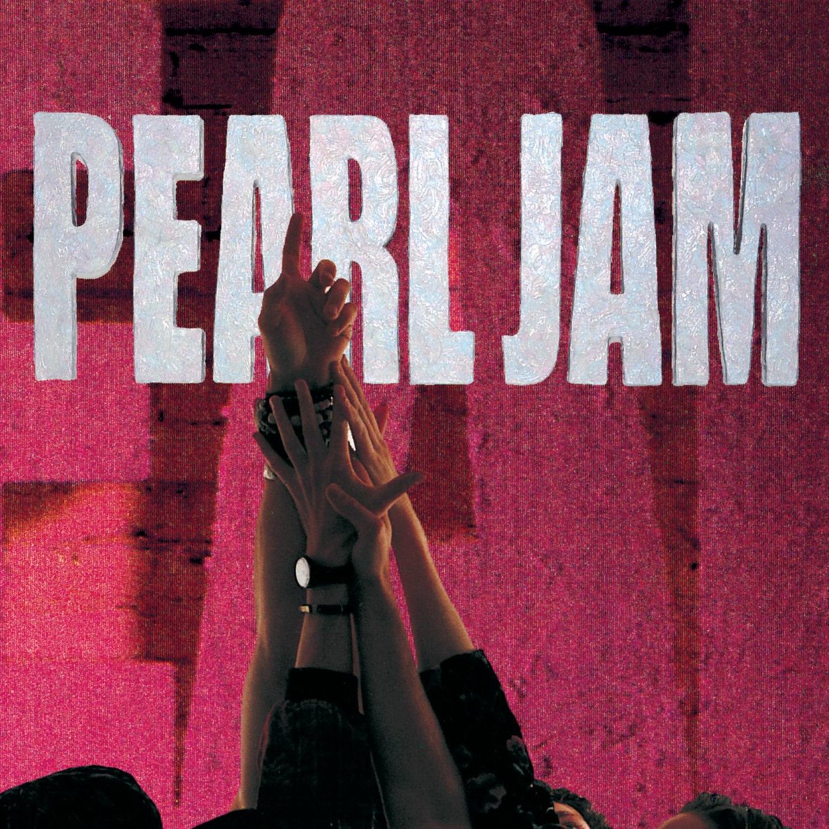Cover of Pearl Jam's album, "Ten"; it's a closeup of the band members embracing hands in the air