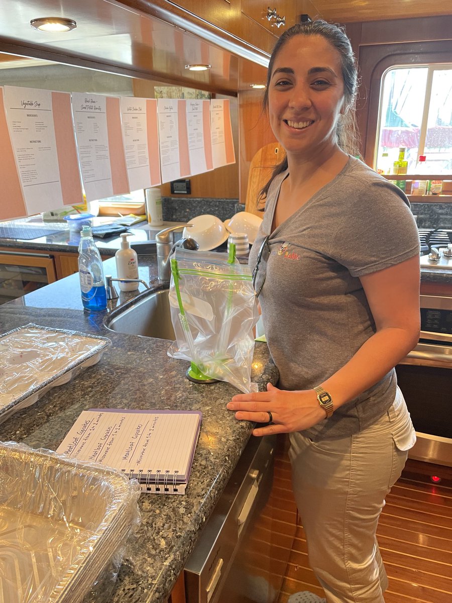 DonKohlmann's tweet photo. Nordhavn 64, “Kapowai” crew member Rumi Burger preparing frozen meals for their passage to Ensenada today.  Note her menus posted and the neat ziplock holders that clamp to the counter and hold the bags for filling or drying them. https://t.co/N3zTL0ZSsG