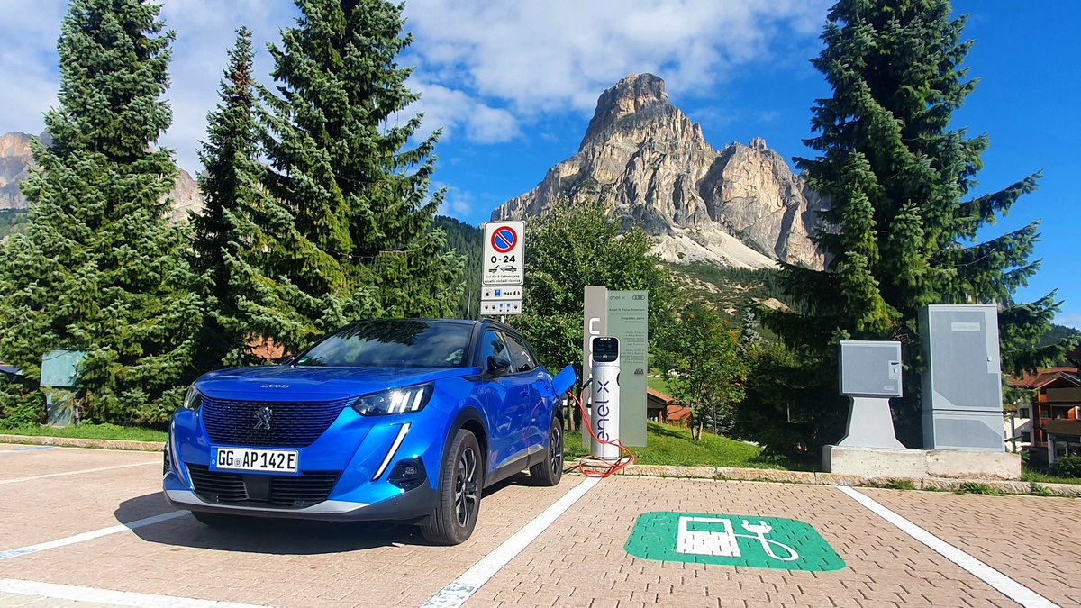 THEnergyNet's tweet photo. Charging #ElectricVehicles can be beautiful! Here during my #DiscoverEmobility trip with a Peugeot e-2008 at an @EnelXGlobal charger in Corvara. #emobility https://t.co/pTidb0NRmP