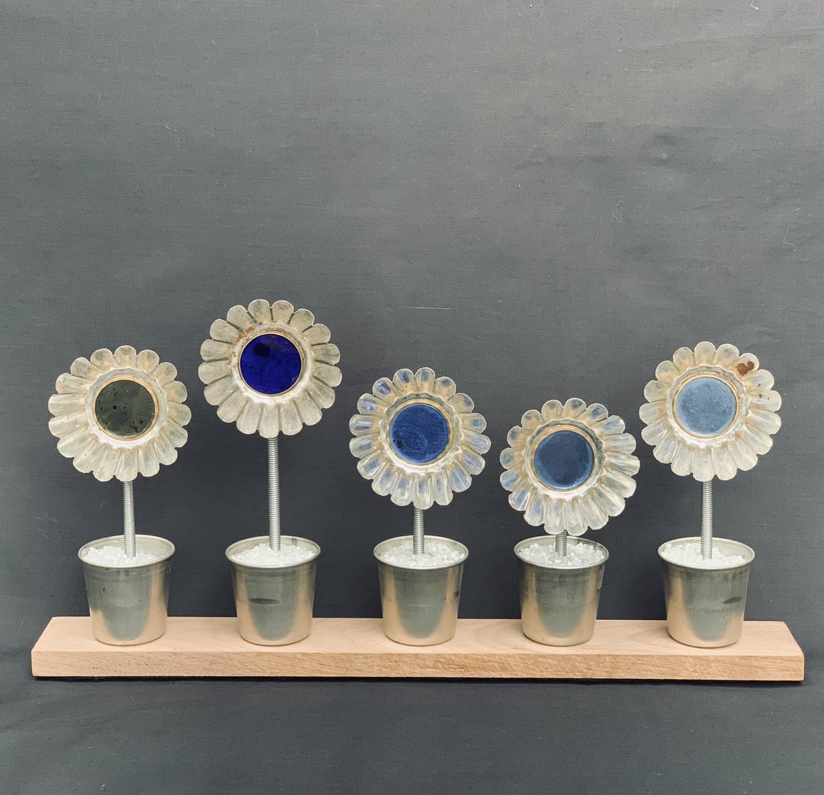 Just finished this new piece using old tin pie dishes and vintage blue glass spectacle lenses on a nice bit of walnut. #profoundobjects