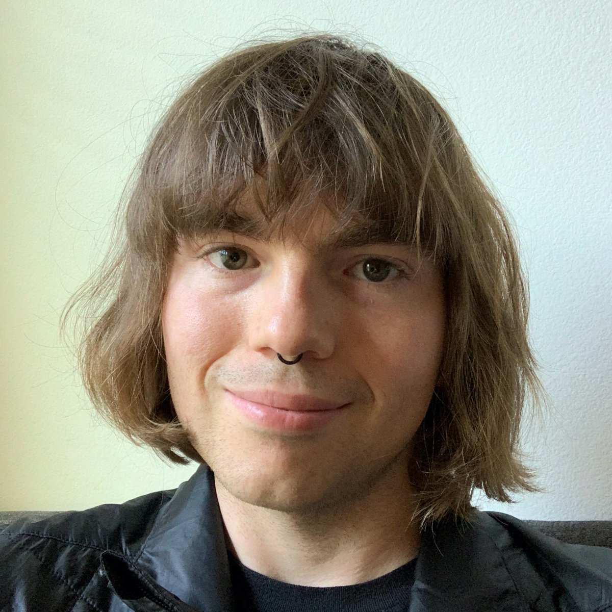 Selfie of Ricky, happy. They’re feeling cute.