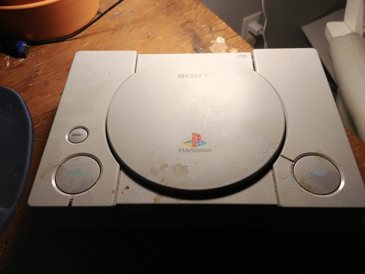 I found my original (grimy and dusty) PlayStation, and thought it'd be fun to pop it open and find out what the last game I played on it was. Turns out it was a bootleg copy of Suikoden II. Good taste, younger Aidan.