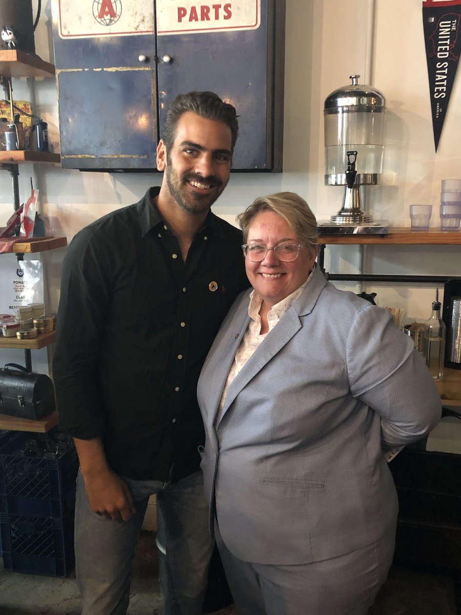 HRC with Nyle DeMarco at DNC community breakfast event.
