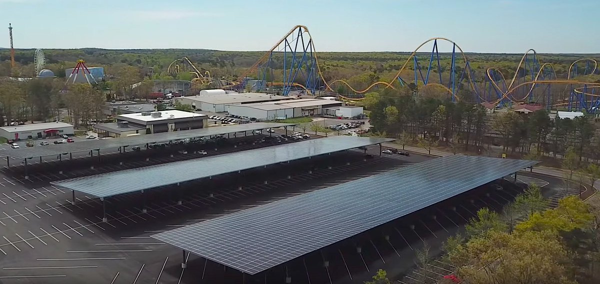 SunPower's tweet photo. #DYK: The Nitro at @SixFlags New Jersey now overlooks the largest SunPower solar carport on the East Coast! Clean energy + a cool covered parking lot = sustainable summer fun. https://t.co/wnzQatSx9X  #hypercoaster #commercialsolar https://t.co/DHUimfX3lF
