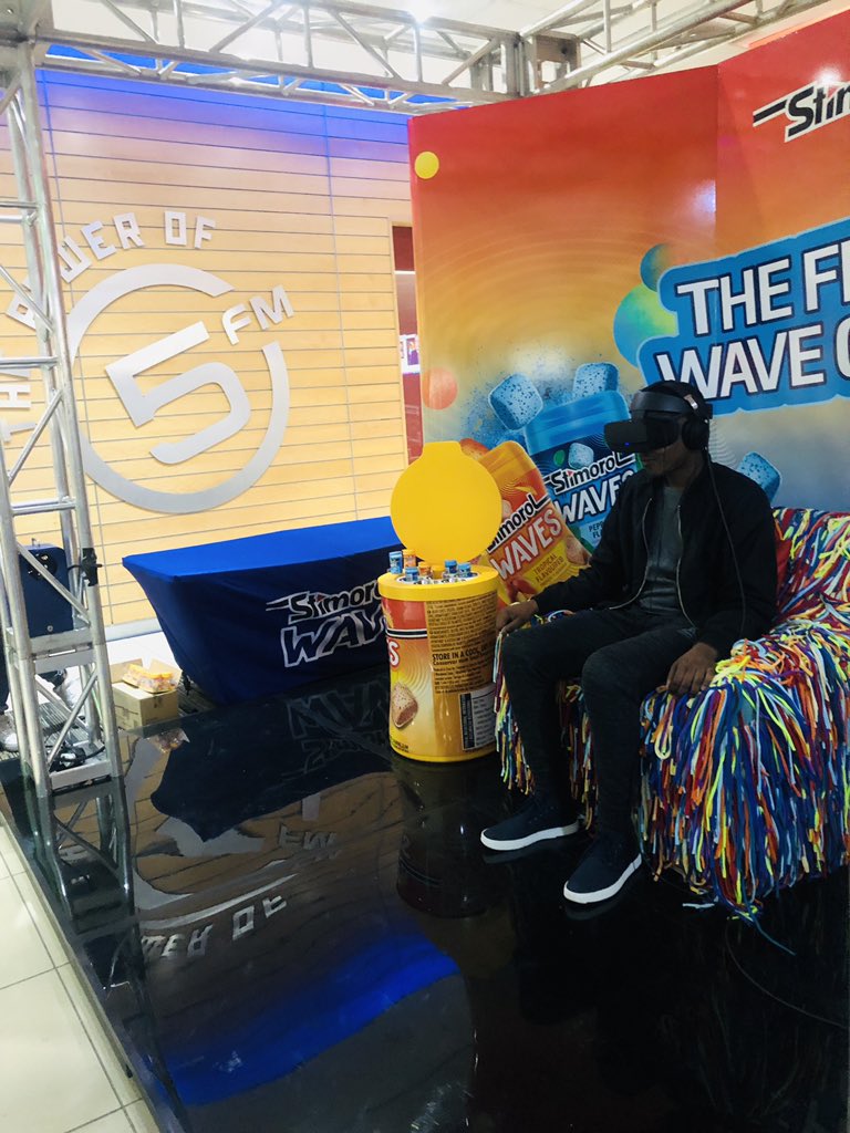 5FM's tweet photo. Today, @StimorolSA is ringing in the weekend in the waviest way possible. 🤩They’ve brought along some of their delicious gum and a chair of adventure just outside our studios🙌They’re giving some of our SABC Family an experience with a virtual reality Oculus set🤯 #FlavourWaves https://t.co/Meec9hyJpC