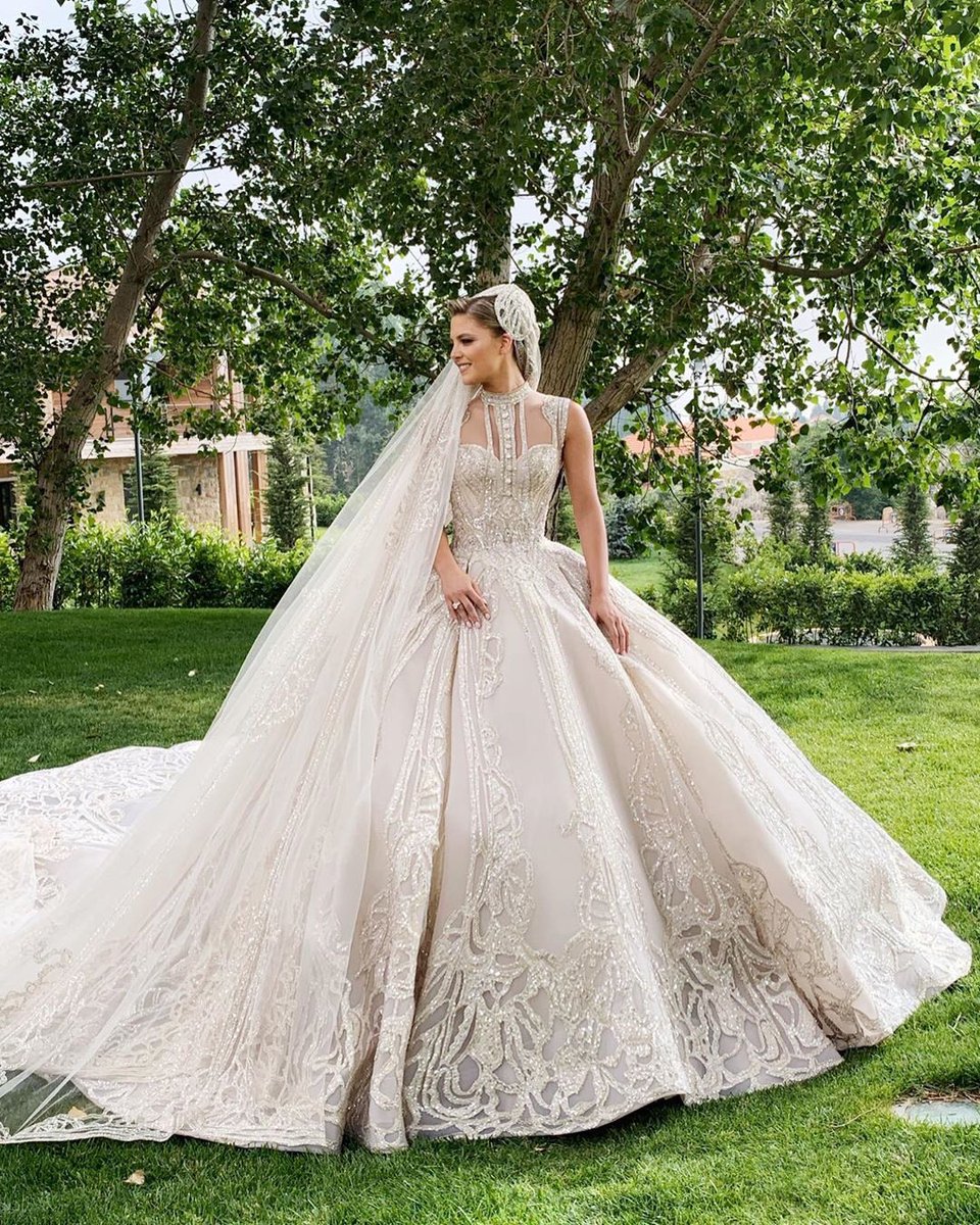 HelloMagazineME's tweet photo. How gorgeous does the bride look in the spectacular gown custom made by her father in law. The couple got married in a beautiful ceremony in Beirut, Lebanon on Friday ✨ @bassamfattouh #eliesaab #eliekiki #wedding #hellomagme #hellomag #hello #hellostylefiles #helloloves https://t.co/iRm2cSMUi3